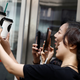 Customers take pictures of cups of tea named in the fashion of the Sang subculture at the Sung Tea shop in Beijing